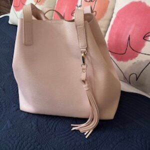 Pastel pink shoulder bag with tassle emblellishment